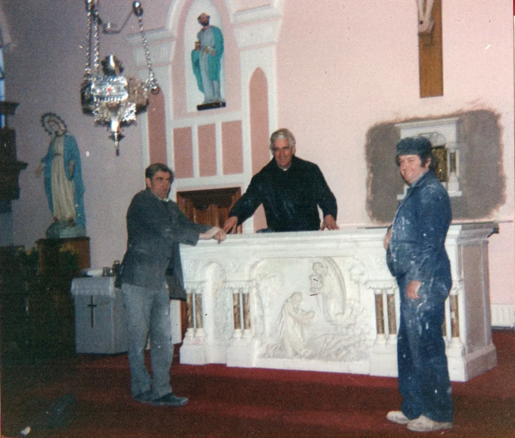 Michael Haugh, Fr Michael Hillery and Michael Corry installing the Carrara marble altar, January 1992